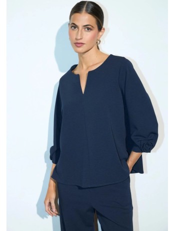 Blue Blouse with a Flower on the Sleeve
